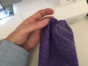 Gather the bottom of the pumpkin with a running stitch.