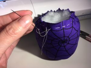Use another running stitch around the top.