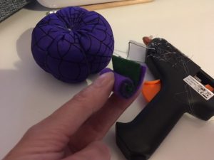 Create a stalk with felt and glue.